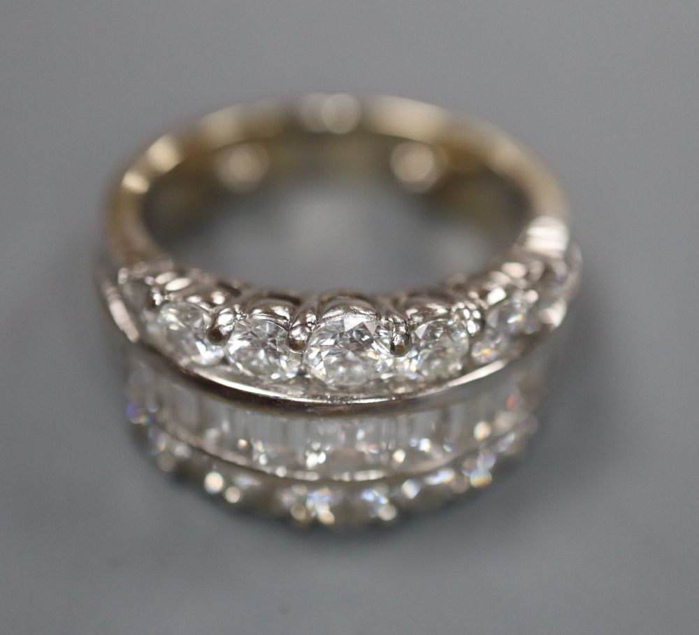 A modern 18ct white gold and three row baguette and round cut diamond set dress ring, by Picchiotti, size I/J, gross 10 grams.